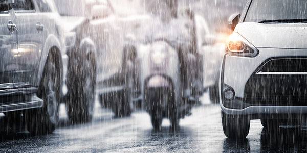 Hard rain fall in the city with blurry cars .Selective focus and outdoor dome security cameras
